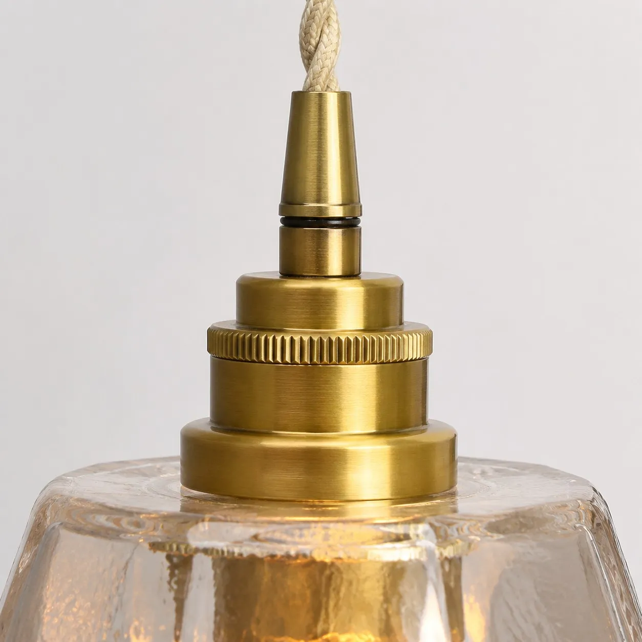 Antique brass lamp holder close-up on faceted glass shade