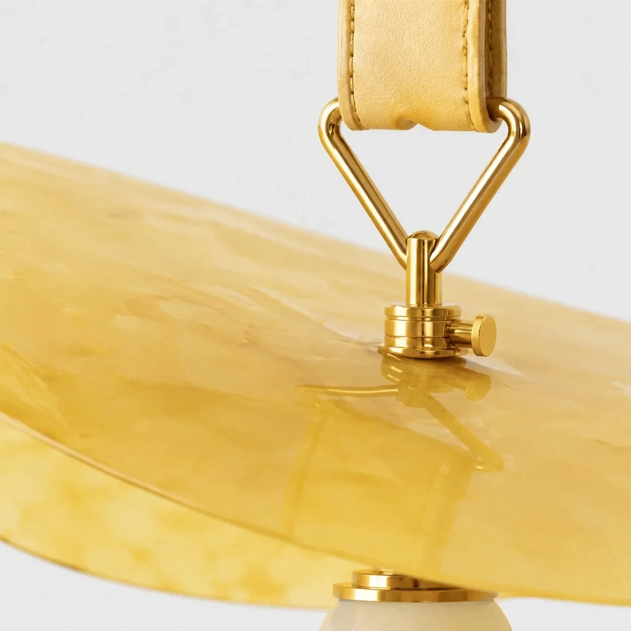 Polished brass connector and shade surface detail