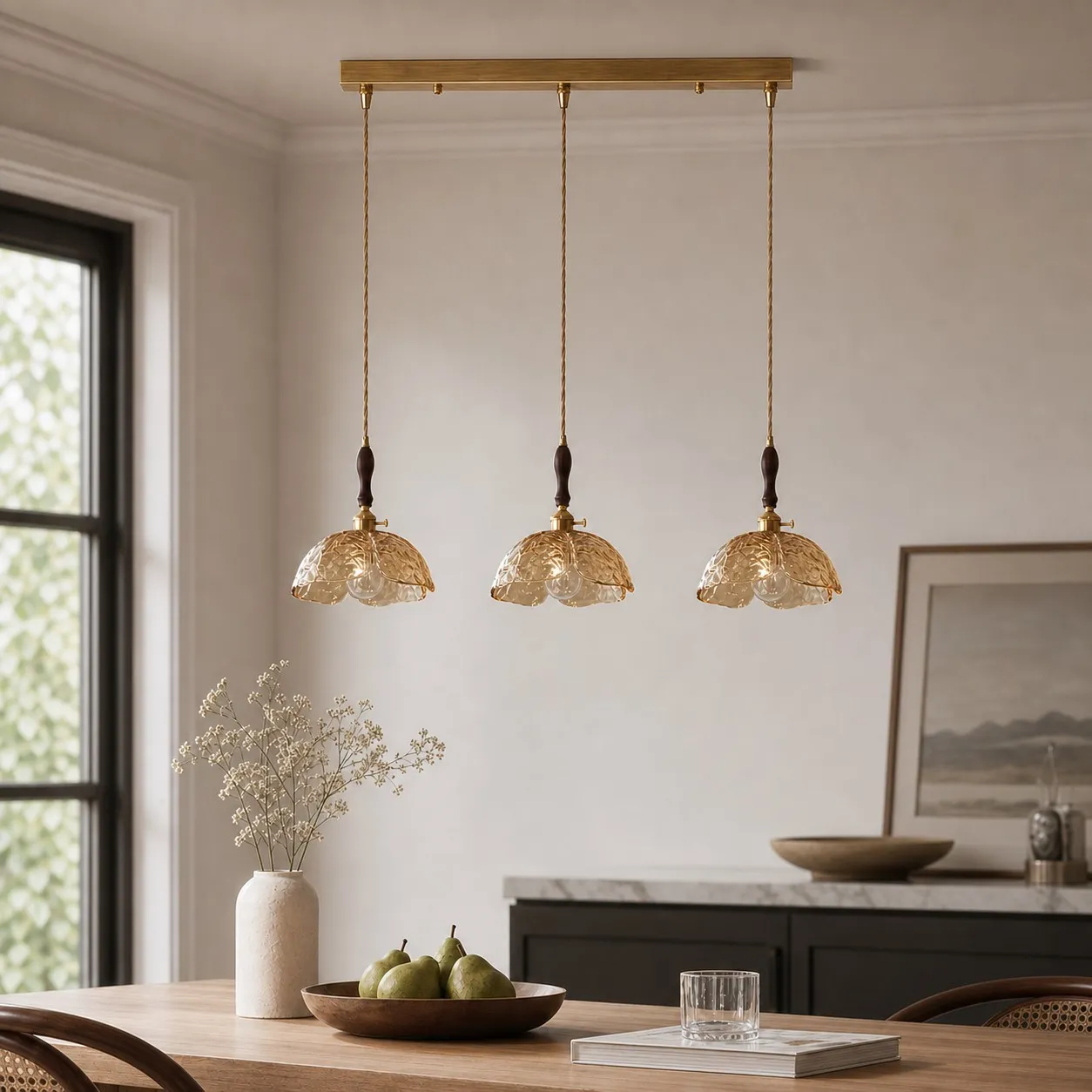 Amber brass flower pendant above a dining table