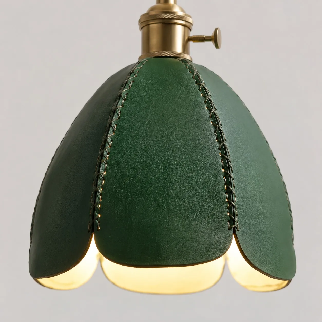 Green leather scalloped shade detail on pendant light